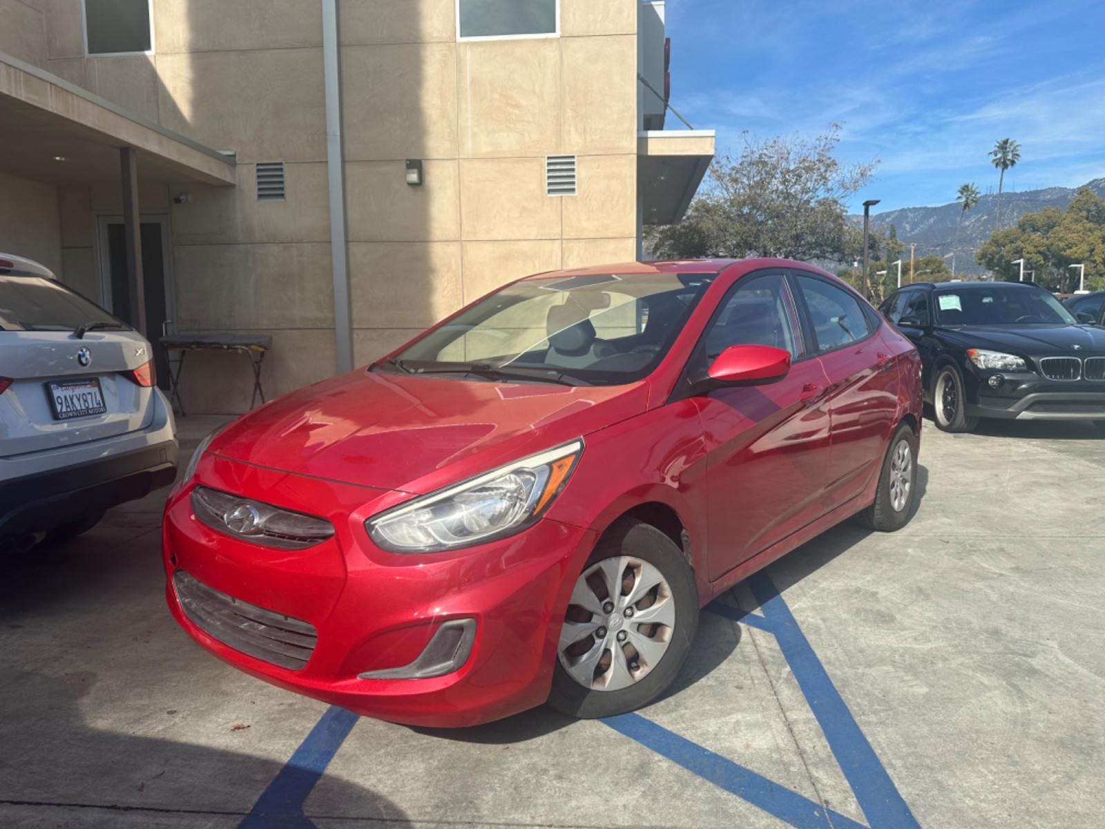 2015 Red /Gray Hyundai Accent GLS Sedan 4D (KMHCT4AE2FU) with an 4-Cyl, 1.6L engine, Auto, 6-Spd w/Overdrive transmission, located at 30 S. Berkeley Avenue, Pasadena, CA, 91107, (626) 248-7567, 34.145447, -118.109398 - The 2015 Hyundai Accent 4-Door Sedan stands as a testament to Hyundai's commitment to quality, efficiency, and value. Located in Pasadena, CA, our dealership specializes in providing a wide range of used BHPH (Buy Here Pay Here) cars, trucks, SUVs, and vans, including the remarkable Hyundai Accent. - Photo #0